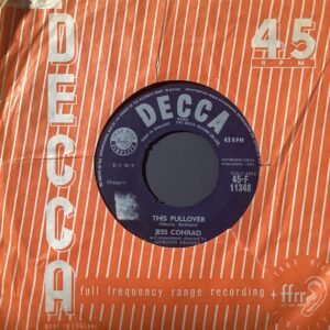 Close-up of an orange Decca Records box with a purple/black vinyl record partially visible in a circular cutout, showing '45') and track details.